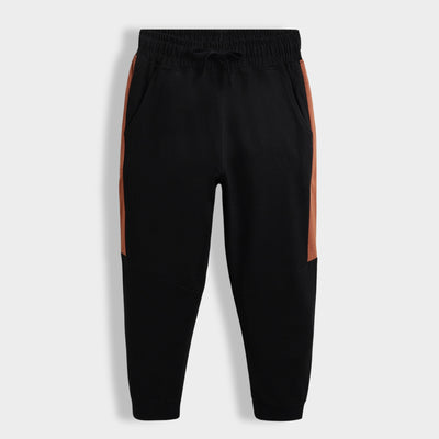 Black jogger pants with brown side panels on a white background