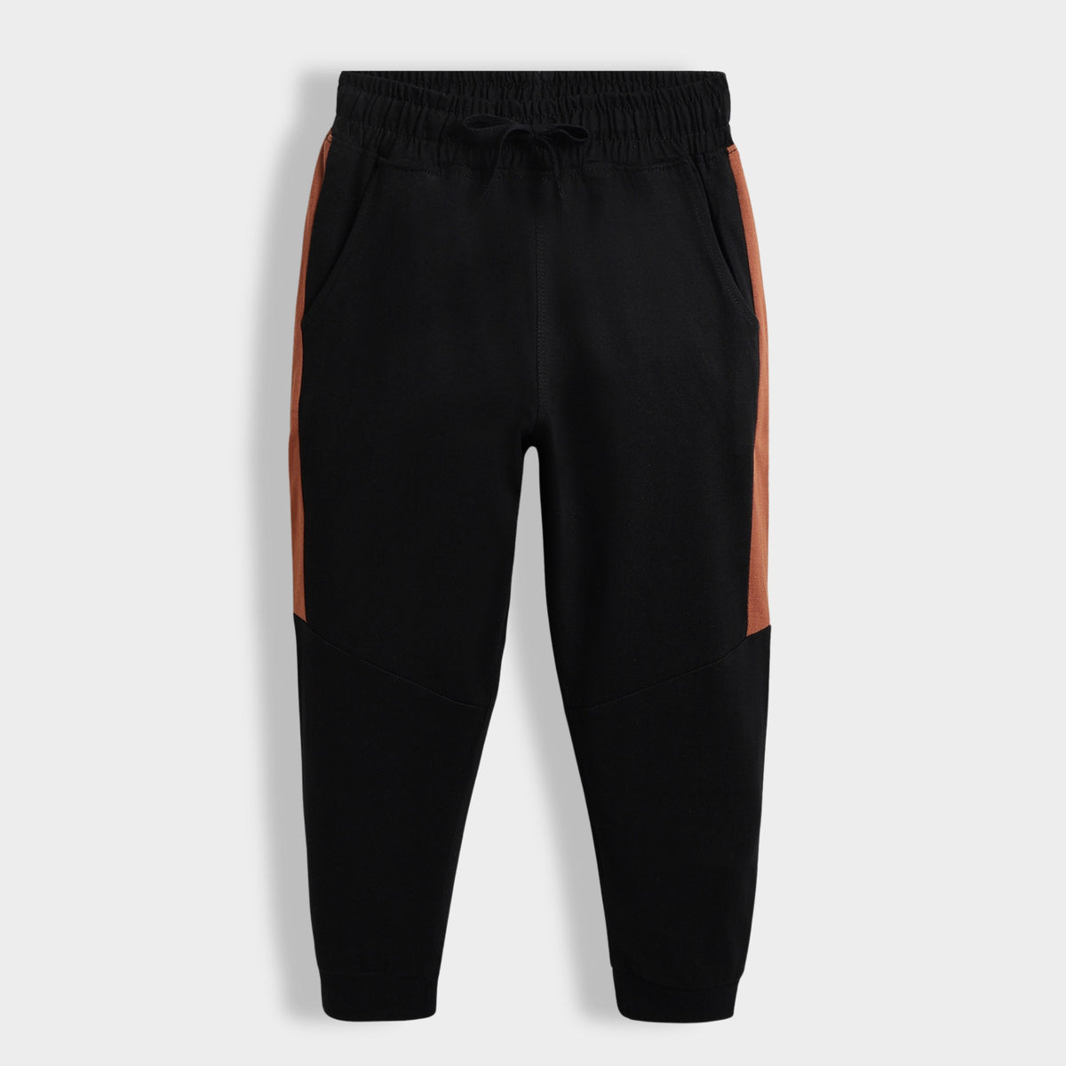 Black jogger pants with brown side panels on a white background